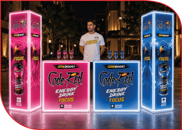 future-plan-code-red-focus-3d-booth-design-jeddah-park.webp تصميم 3D لبوث Code Red Focus من تنفيذ Future Plan، يظهر كاونترات مضيئة وأعمدة عرض باللونين الوردي والأزرق ضمن تصور مخصص لفعالية Padel In Challenger في جدة بارك.