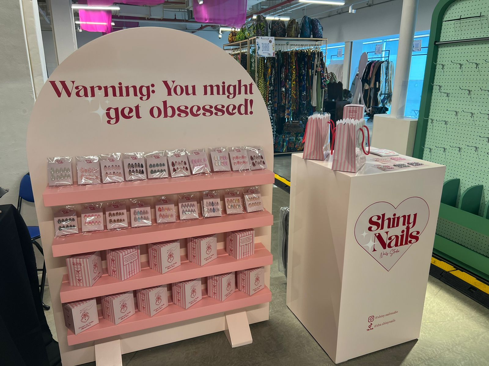 ستاند عرض Shiny Nails النهائي — pop-up display stand with branded counter and product shelves by Future Plan